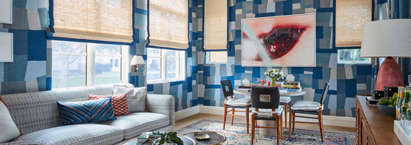 A blue patterned room designed by Peter Dunham featuring a sectional and game table with credenza as a bar.