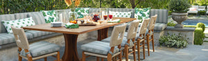 A beautiful outdoor dining scene showcasing the How to Marry a Millionaire dining chairs.