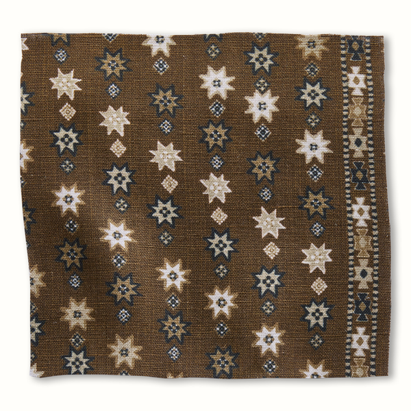 Peter Dunham Textiles Cosima chocolate pillow with geometric star pattern in cream and navy