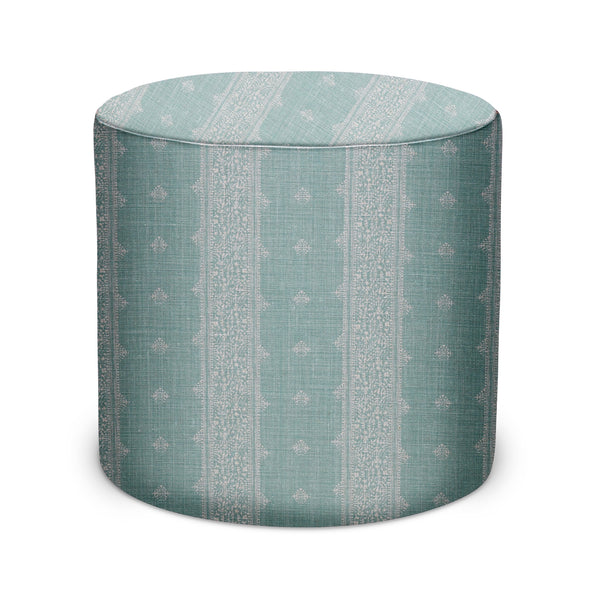 Indoor pouf in pale blue fabric with geometric motif, cylindrical with flat top