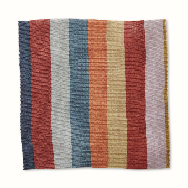 Multi-color vertical stripe pillow cover in red, blue, beige, and tan.