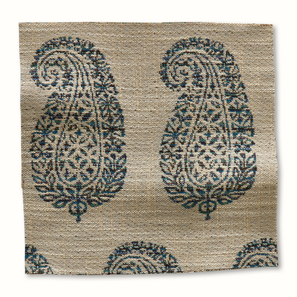 Outdoor pillow cover with natural fabric and blue paisley-style medallion pattern