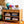 Orange geometric rug with multicolor motifs and fringed edge
