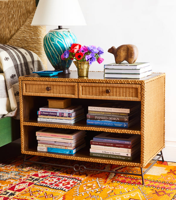 Orange geometric rug with multicolor motifs and fringed edge