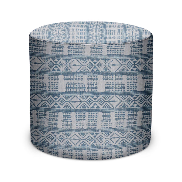 Cylindrical indoor pouf with blue and white geometric fabric pattern