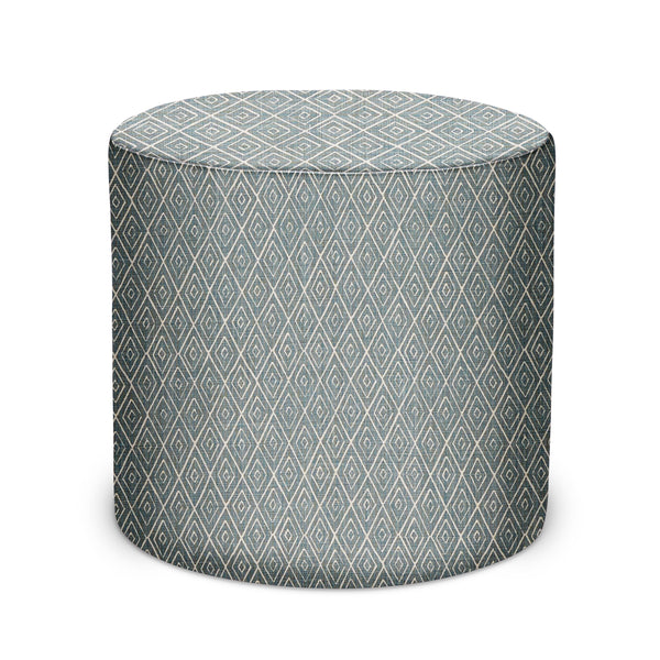 Round indoor pouf with teal geometric lattice upholstery and padded top