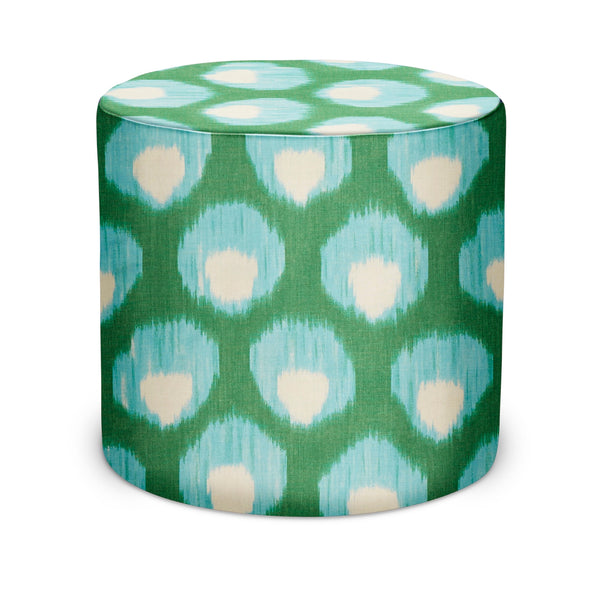 Indoor pouf with green and aqua geometric pattern and cream accents, cylindrical fabric top