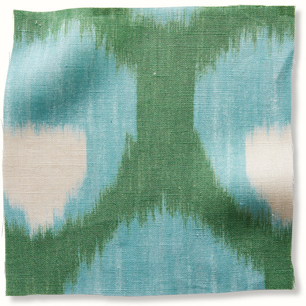 Green and blue abstract woven pillow cover with bordered edges