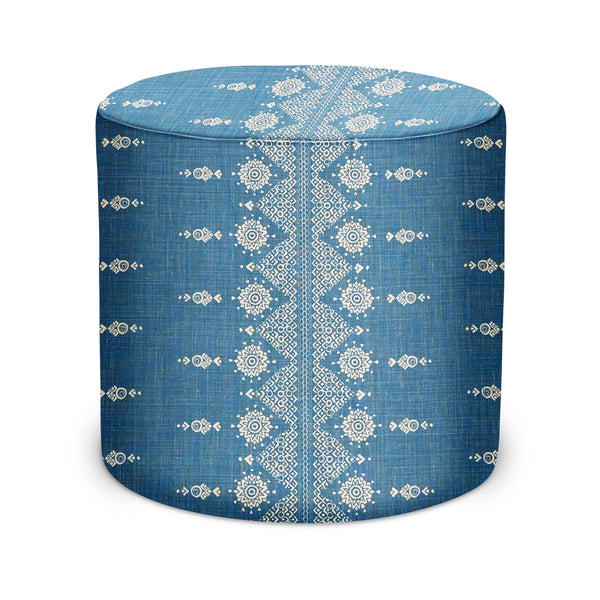 Indigo fabric indoor pouf with white geometric medallion pattern, round cylinder shape