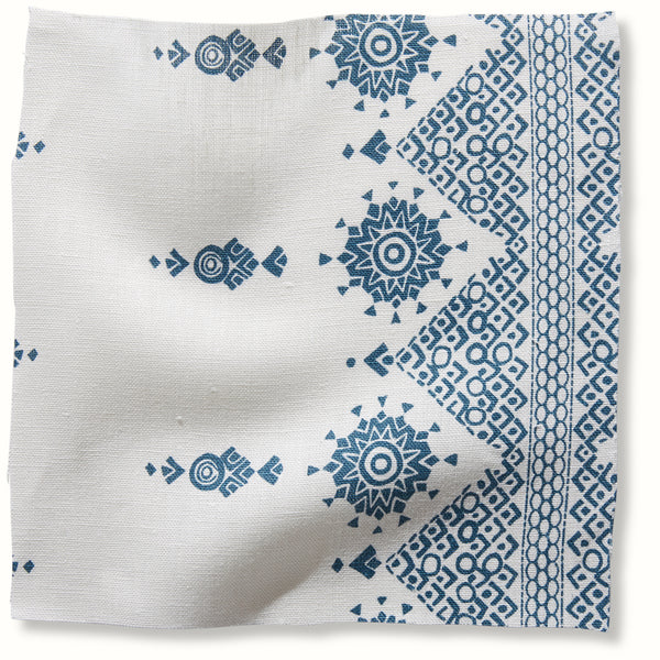 Blue geometric pattern on white square pillow cover fabric