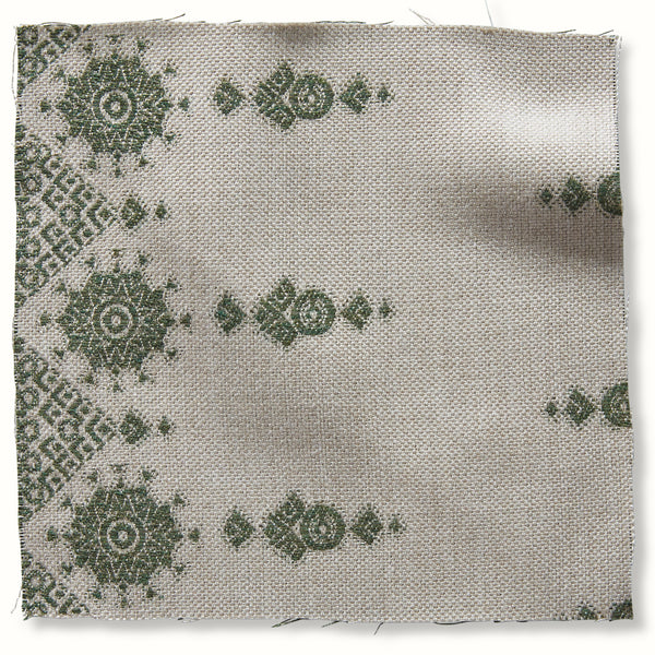 Outdoor pillow cover by Peter Dunham Textiles, natural fabric with green geometric pattern