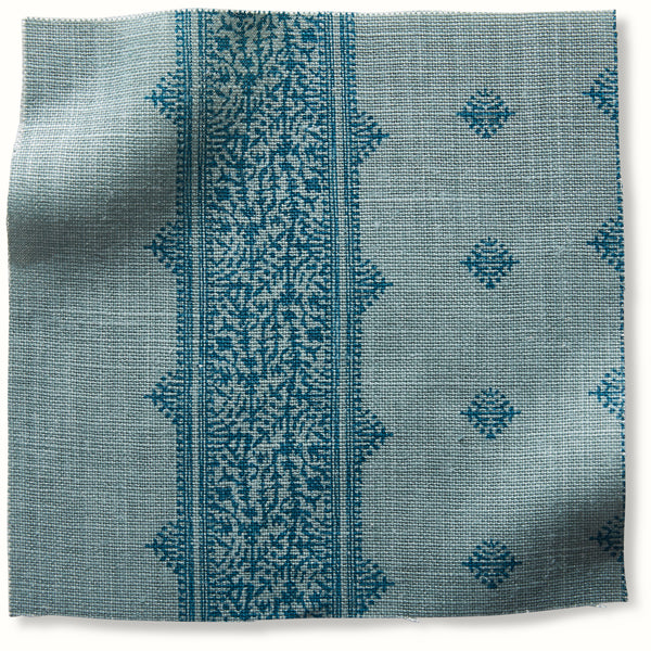 Blue pillow cover fabric with fez stripe panel and scattered geometric motifs