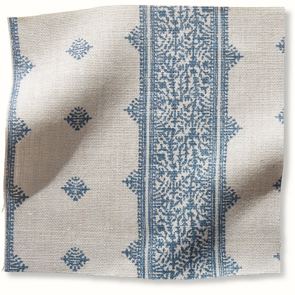 Blue and natural patterned pillow cover with vertical center panel and small motif accents