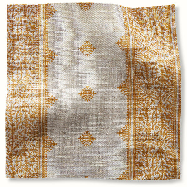 Natural linen-look pillow cover with gold stripe border and small motif pattern.