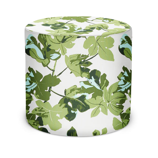 Indoor pouf with green fig leaf pattern on off-white fabric, rounded cylindrical shape