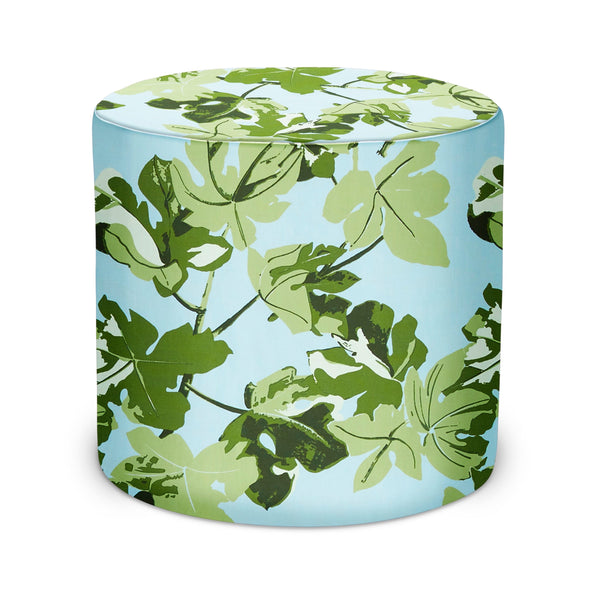 Indoor pouf with green fig-leaf pattern on light blue round fabric stool
