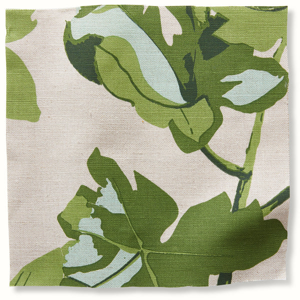 Natural pillow cover with large green fig leaf pattern on light neutral fabric