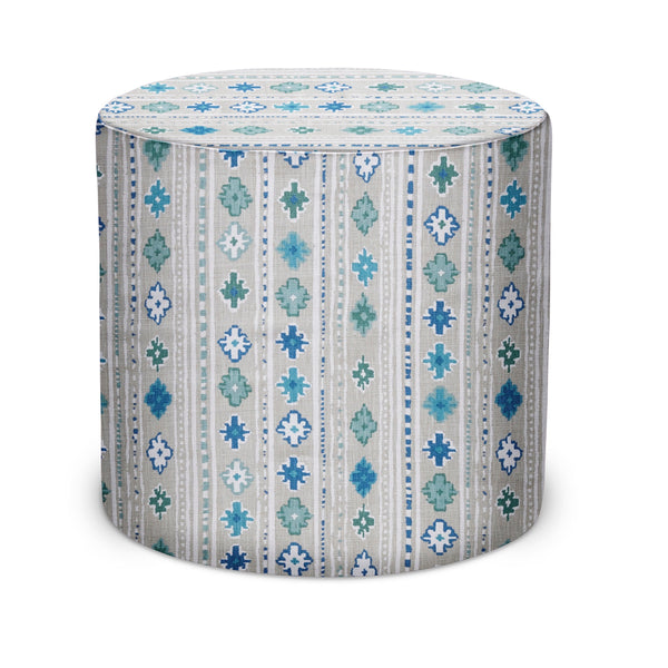 Indoor pouf with cylindrical top, striped floral pattern in blue, teal, and white