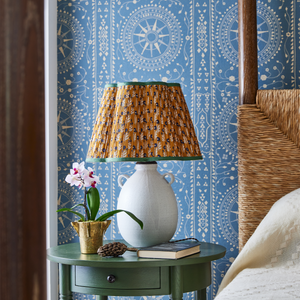 Ceramic jug table lamp with pleated multicolor drum shade and side loop handles