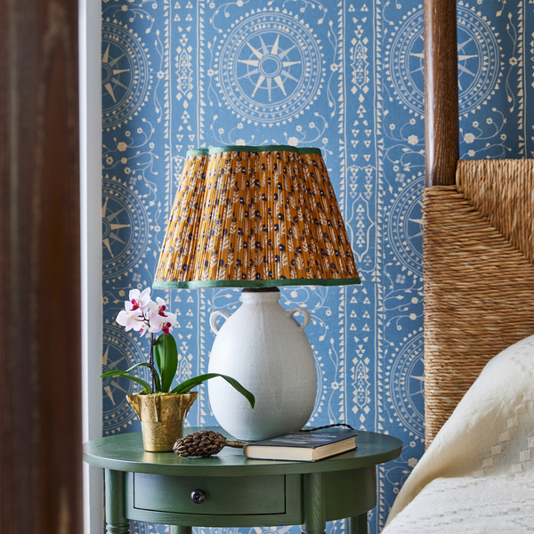Ceramic jug table lamp with pleated multicolor drum shade and side loop handles