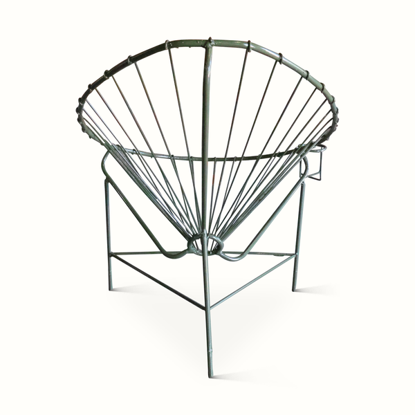 Iron Acapulco chair showing arm-like supports and wire lattice seat, green and black