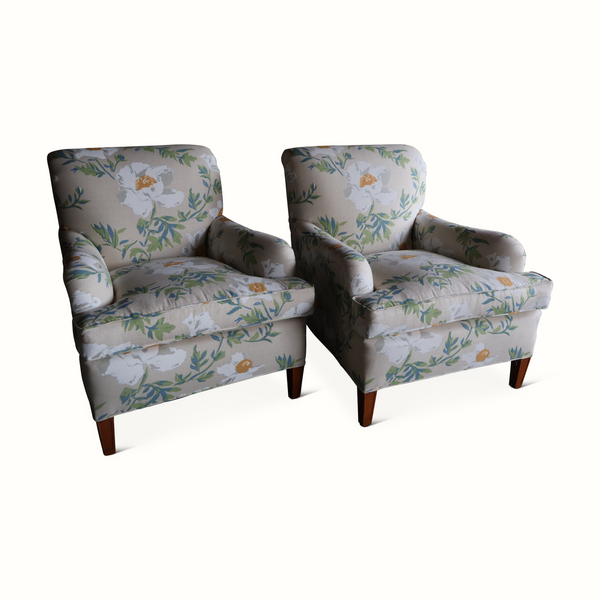 Pair of matching wingback armchairs, floral light gray upholstery with dark wooden feet