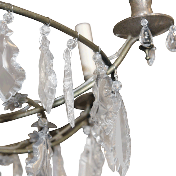 Antique bronze chandelier arm with clear crystal drops and candle-style bulbs