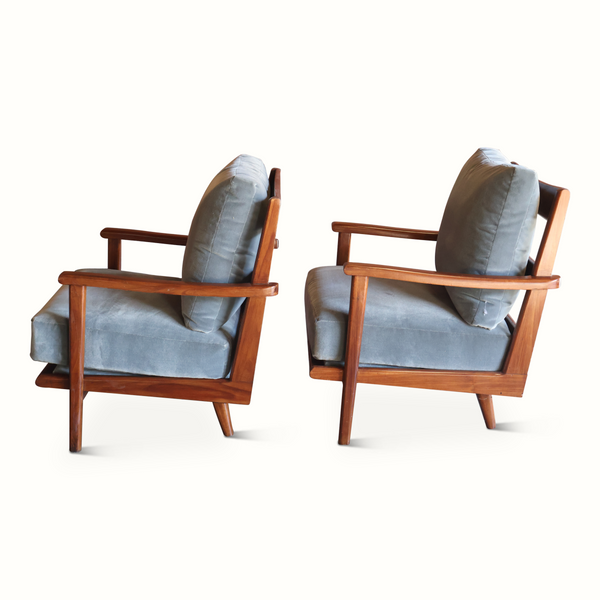 Pair of wooden armchairs angled view with light blue upholstered cushions