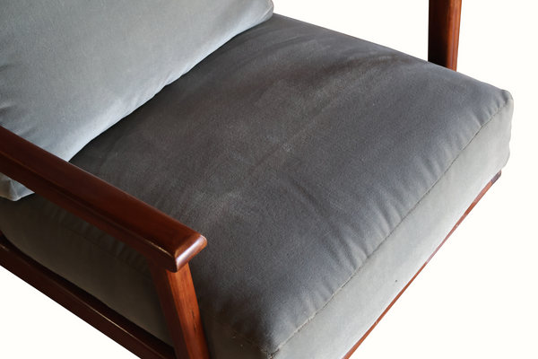 Wooden armchair seat cushion in light blue with angled armrest