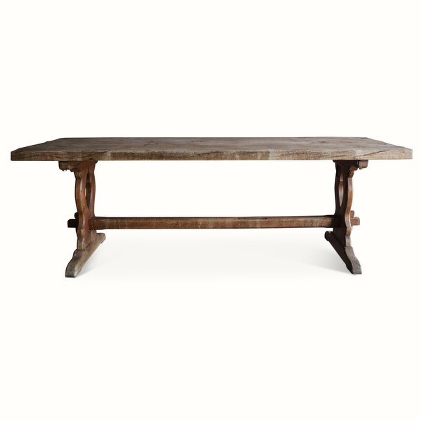Antique French oak refectory table with weathered top and carved trestle legs
