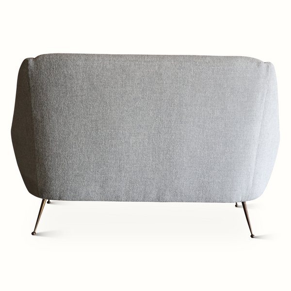 Light gray upholstered mid-century settee back with tapered metal legs.