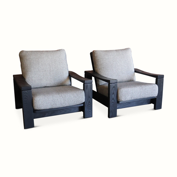 Pair of elm armchairs with dark wood frames and striped light blue linen cushions