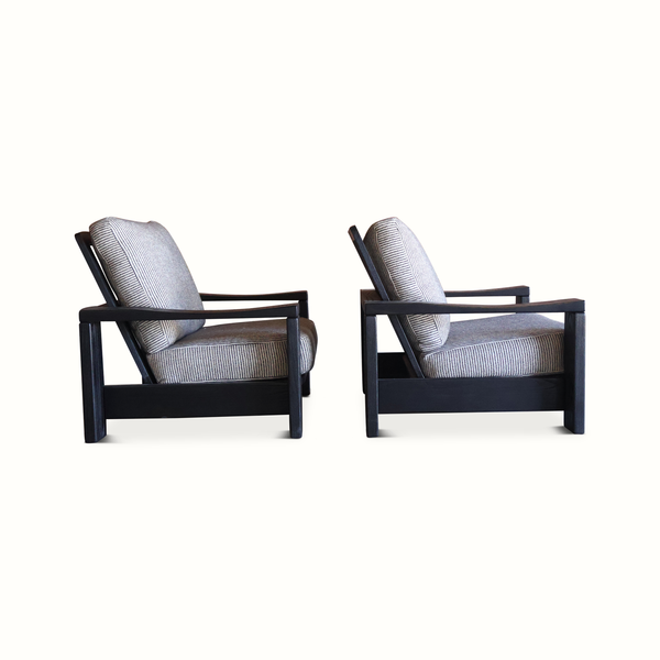Pair of elm armchairs side view with dark wood structure and striped light blue linen