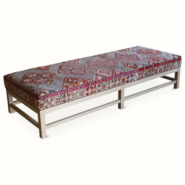 Lexington ottoman with vintage Persian rug-pattern upholstery and wooden legs
