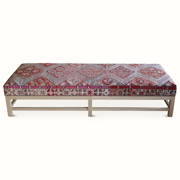 Lexington ottoman bench-style with folded rug-pattern seat and wooden frame