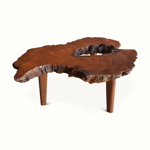 Live edge side table, wide wooden top with blue resin inlay, three tapered legs.