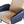 Lounge chair arm and seat with beige sheepskin cushion and dark blue leather sides