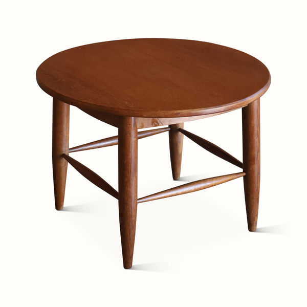Solid wood side table, dark brown round top with tapered legs and X-shaped support