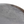 Close-up of round marble tabletop with light gray and brown veining, curved rim