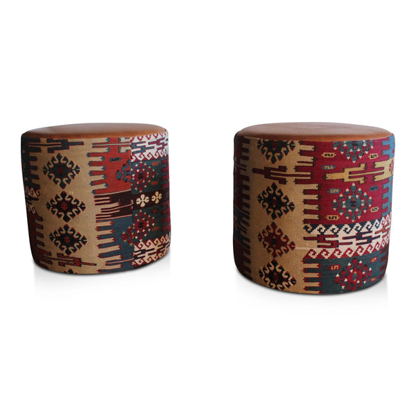Turkish kilim leather pouf with bold geometric woven pattern and round upholstered form