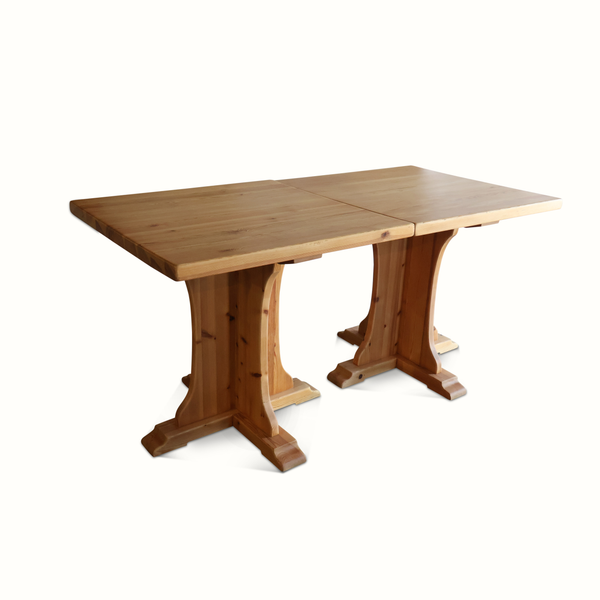 Pine bistro table with split square top seam and trestle pedestal base, light wood.