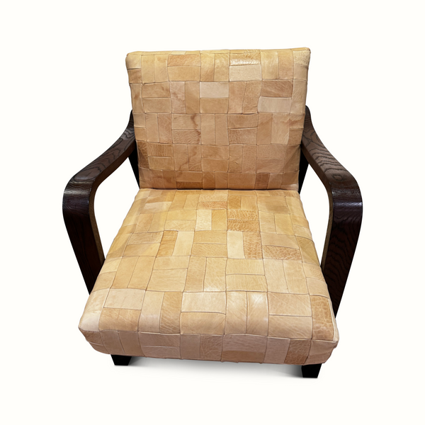 Patchwork leather accent chair front view, tan square patchwork seat and back, dark wood arms