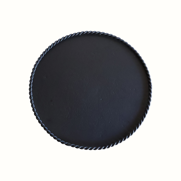 Black gueridon table top with braided rim around the circular surface