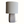 Table lamp with light fabric drum shade and speckled stone base, front view