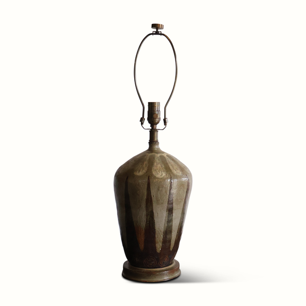 Ceramic pottery table lamp with white drum shade and sculpted drip-glazed ceramic body