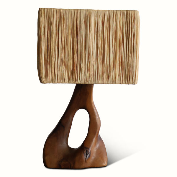 Olive wood table lamp with beige pleated shade and carved warm-brown base with cutout