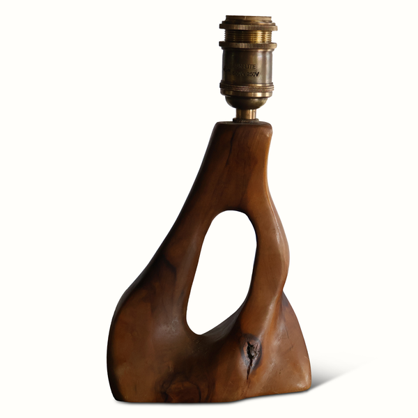 Olive wood lamp with brass socket and carved warm-brown base, cutout opening