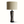 Pottery table lamp with beige fabric shade and blue abstract figure ceramic base