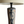 Close-up of pottery table lamp base with blue abstract figure and black mounting top