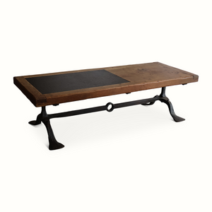 Coffee table with oak top and rectangular slate insert, forged iron legs with ring detail.